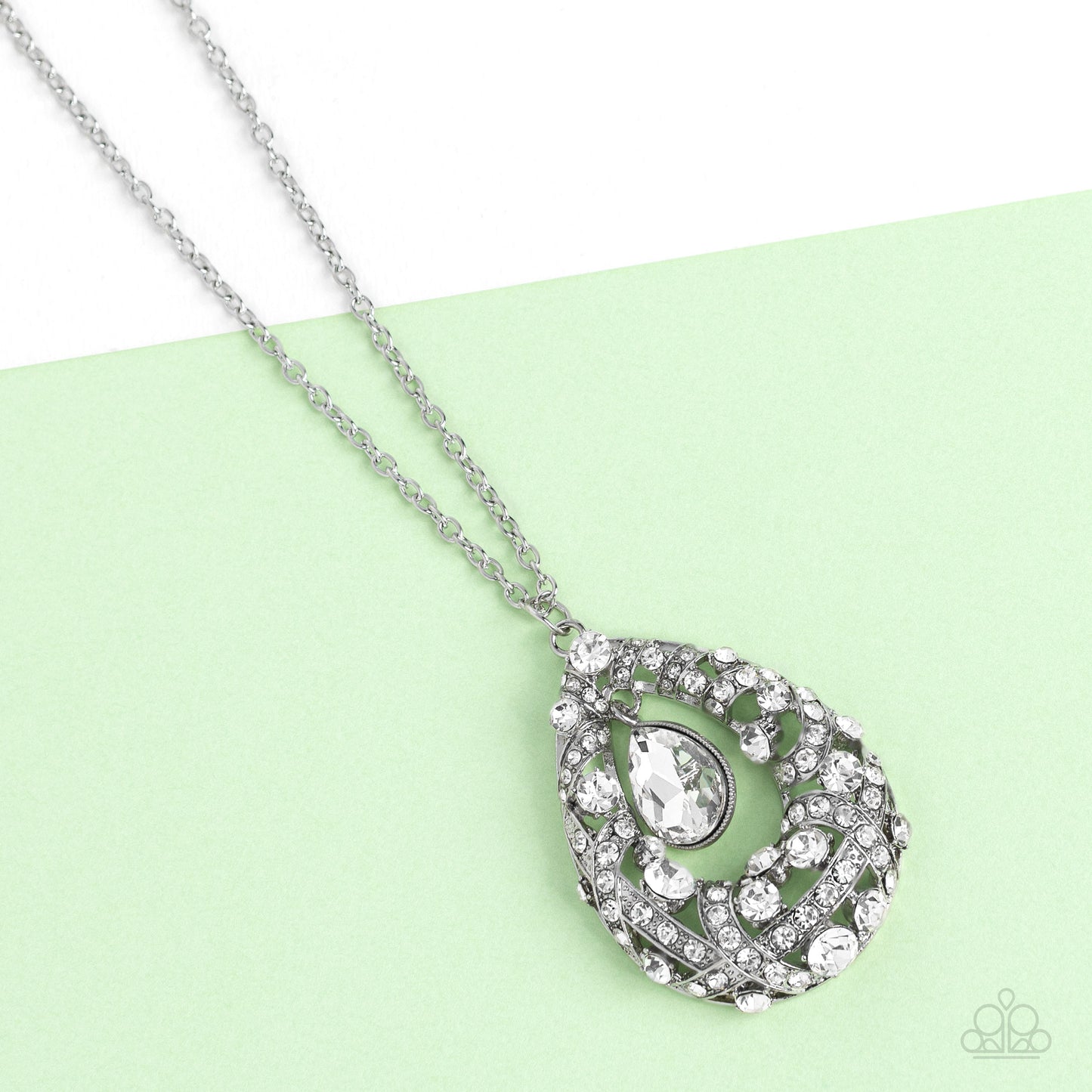 Paparazzi Accessories Glitz and GLOW - White A small teardrop, crystal-like white gem is pressed into a sleek, silver frame as it's suspended from a larger gem and rhinestone-dusted airy teardrop frame. The various sizes of crystal-like gems and white rhi