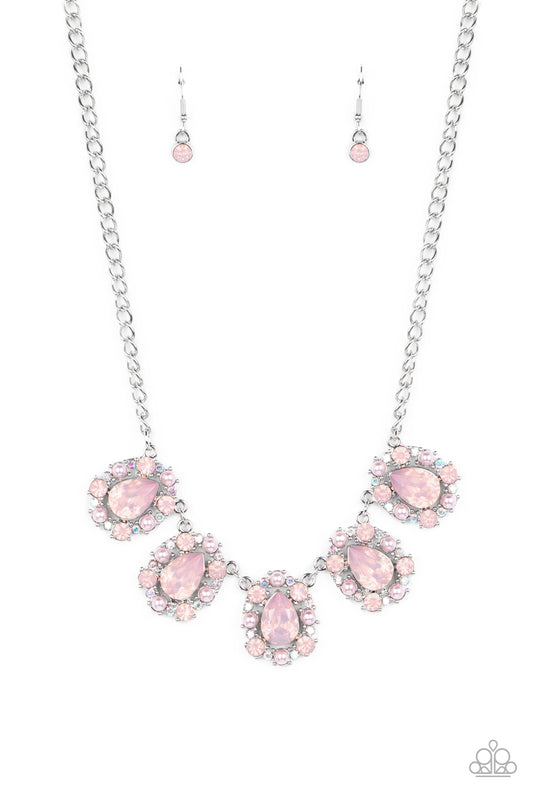 Paparazzi Accessories Pearly Pond - Pink Encased in shimmery silver frames, a collection of pink, opalescent, teardrop gems twinkles above the collar. Dainty pink pearls, pink crystal-like gems, and rhinestones in an iridescent finish surround each teardr