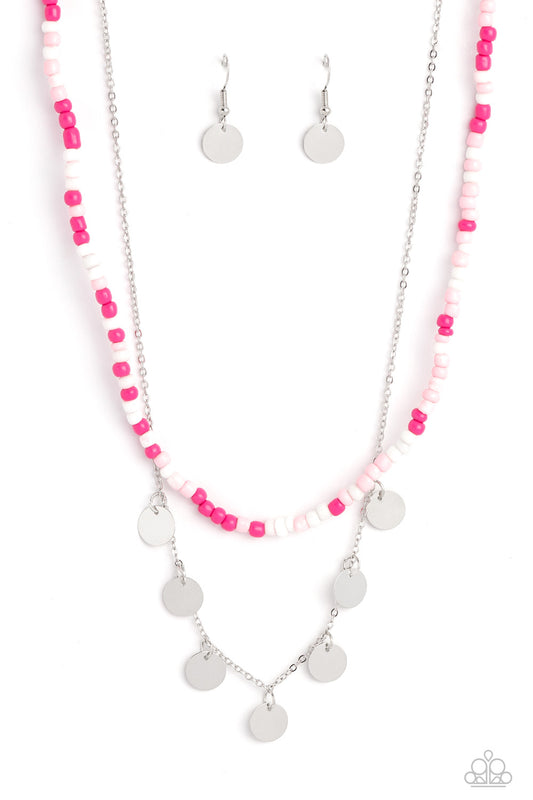 Paparazzi Accessories Comet Candy - Pink Pink Peacock, baby pink, and white seed beads are threaded along a wire, falling along the collar in a capricious pattern. A delicate silver chain, infused with twinkling silver discs, layers together with the colo