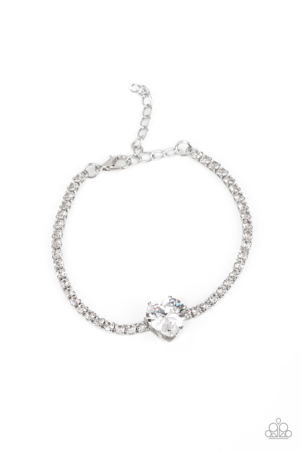 Paparazzi Accessories Bedazzled Beauty - White An oversized white heart-shaped gem, set in an airy, pronged silver fitting, glitters at the center of a blinding row of dainty, glassy white rhinestones set in square silver fittings, resulting in a flirtati