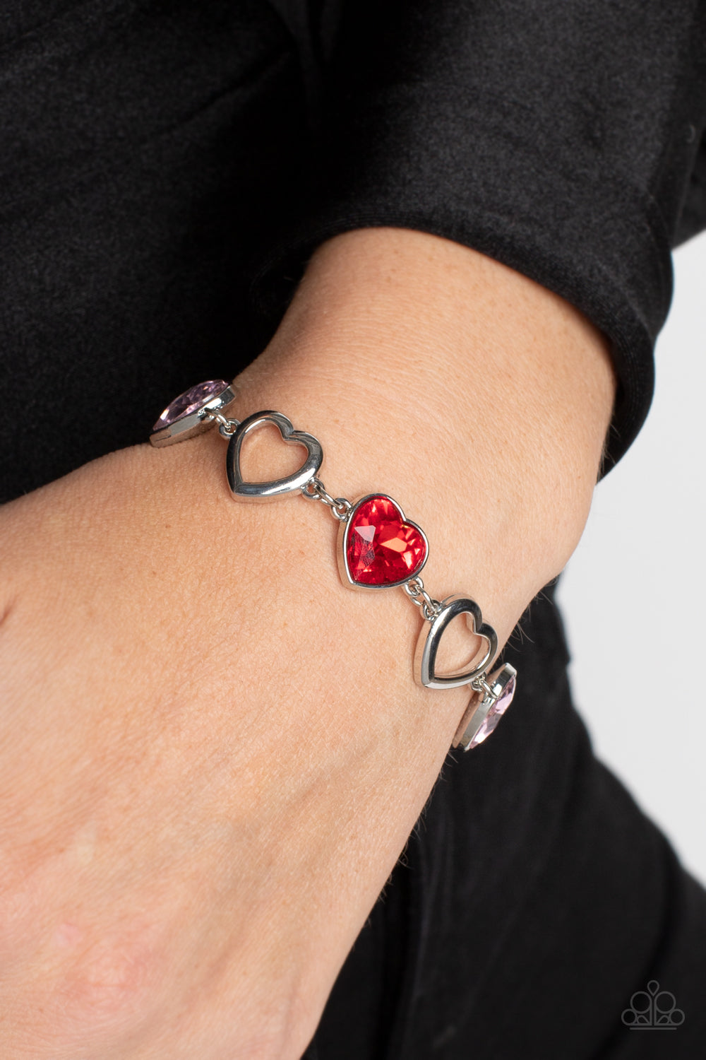 Paparazzi Accessories Sentimental Sweethearts - Multi Airy, sleek, silver heart silhouettes interchange with red and pink heart gems pressed into silver frames for a romantic statement around the wrist. Features an adjustable clasp closure. Sold as one in