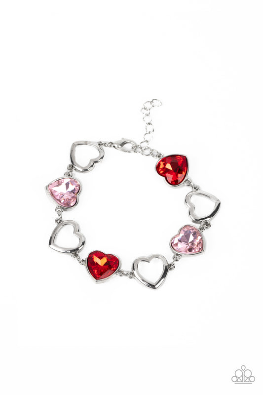 Paparazzi Accessories Sentimental Sweethearts - Multi Airy, sleek, silver heart silhouettes interchange with red and pink heart gems pressed into silver frames for a romantic statement around the wrist. Features an adjustable clasp closure. Sold as one in