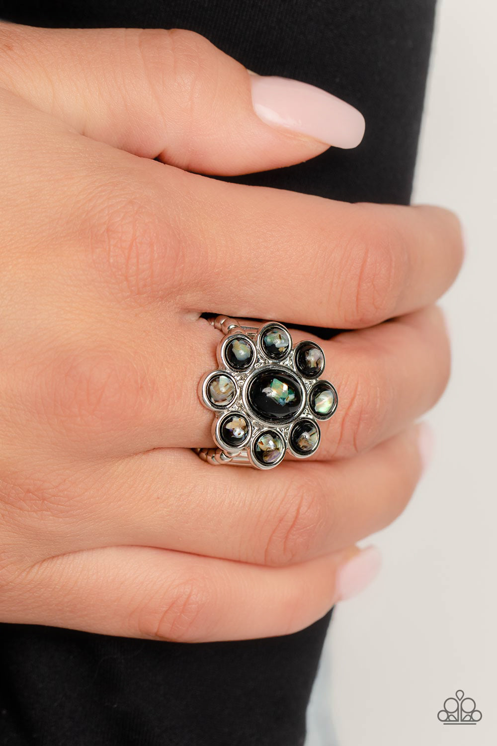 Paparazzi Accessories Time to SHELL-ebrate - Black Pressed into a high-sheen silver frame, flecks of iridescent shell shimmer against a background of black, creating an ethereal flower centerpiece atop the finger. Features a stretchy band for a flexible f