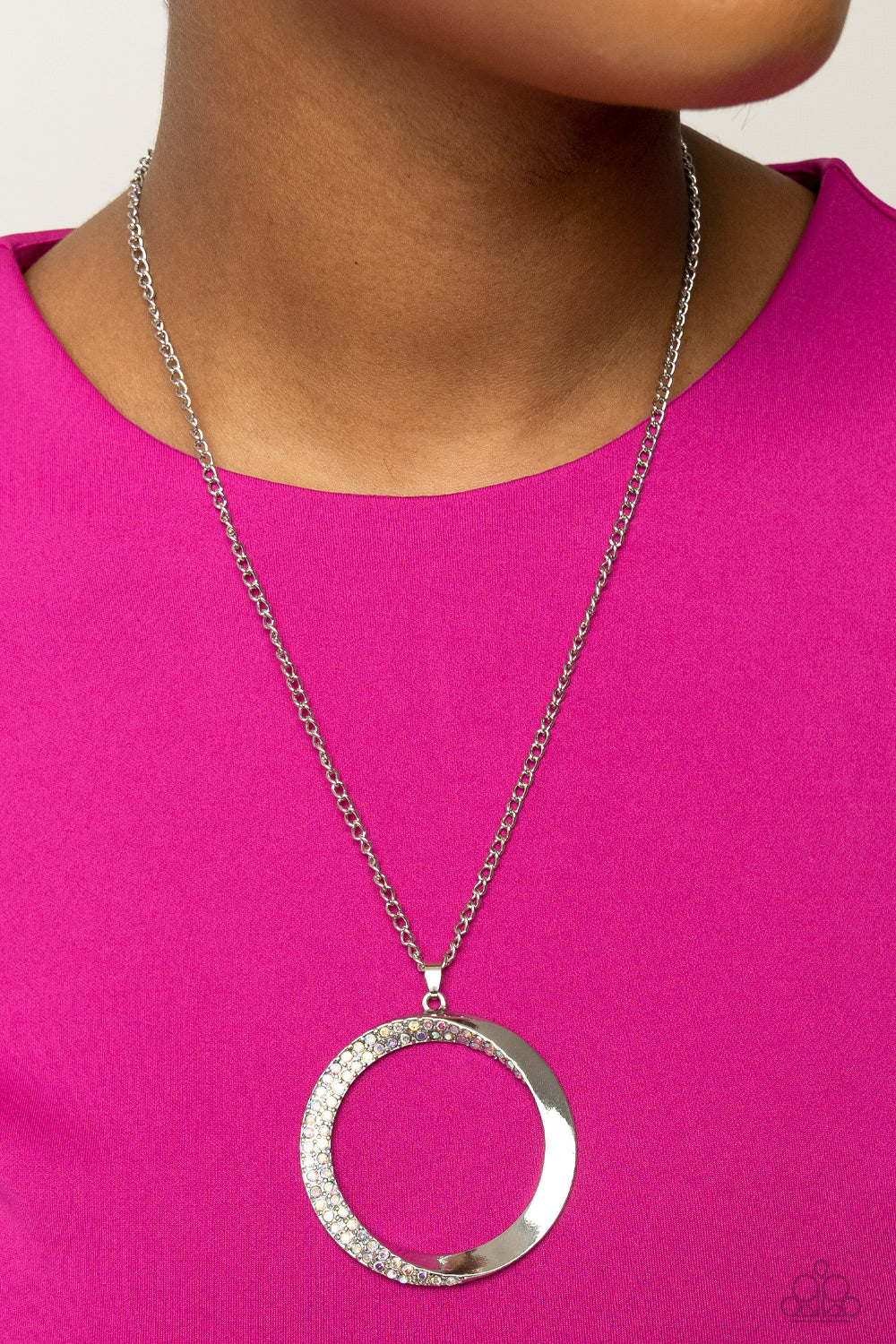 Paparazzi Accessories Encrusted Elegance - Multi An airy, oversized, warped, shiny silver hoop dangles down the chest from a classic silver chain. Two rows of dainty iridescent rhinestones encrust along the inner curve of the hoop for an understated, eleg