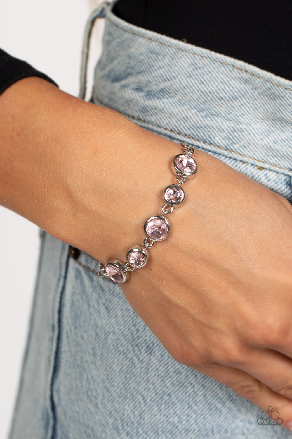 Paparazzi Accessories Classically Cultivated - Pink Varying sizes of classic, round, brilliant-cut pink rhinestones set in thick, circular, silver frames link together around the wrist with glamorous glimmer. The rhinestones attach to a dainty strand of s