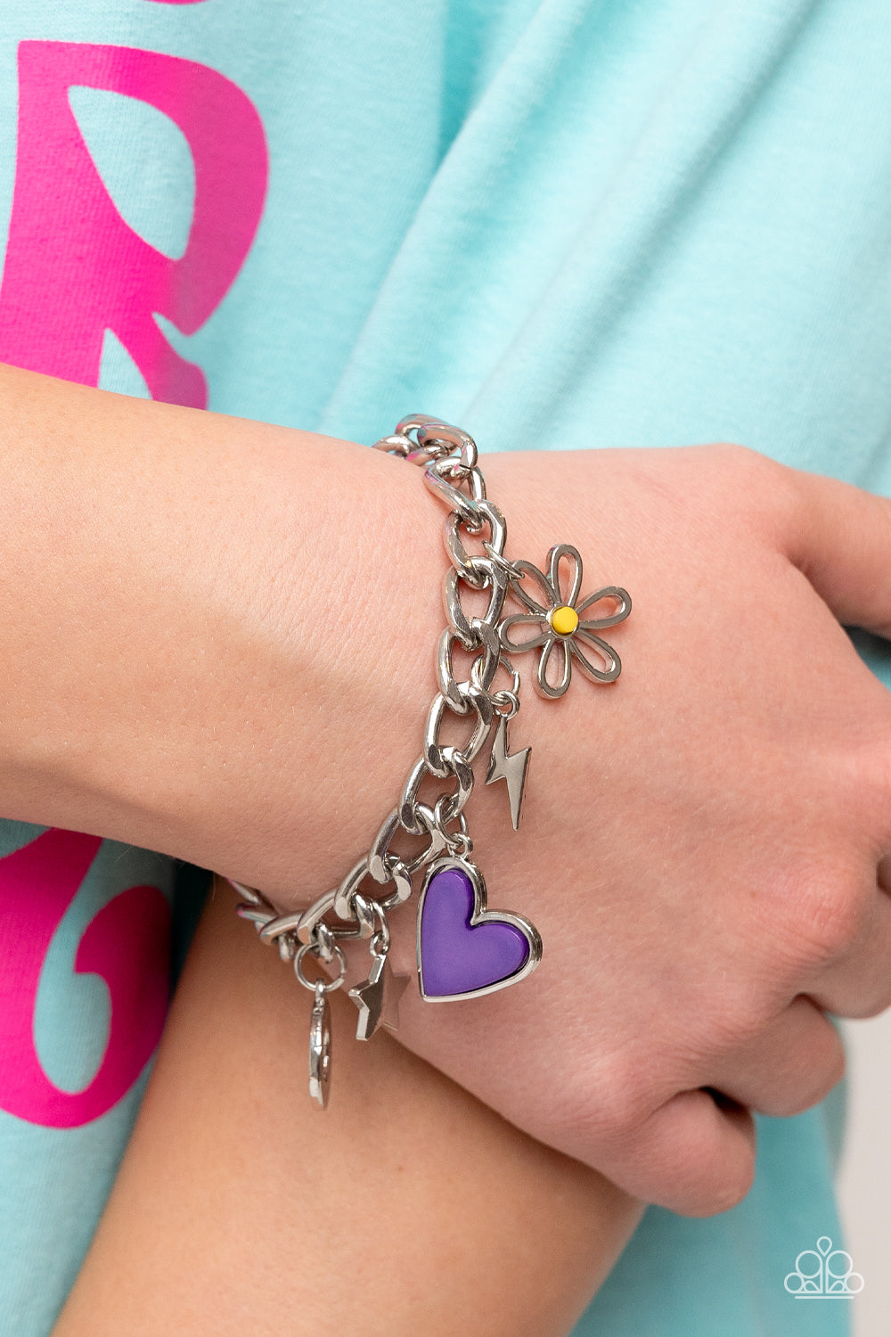 Paparazzi Accessories Turn Up the Charm - Purple A strand of thick silver curb chain is decorated in playful charms, including a purple heart, a silver lightning bolt and star, a blue ring, and a flower silhouette topped with a yellow bead at its center.