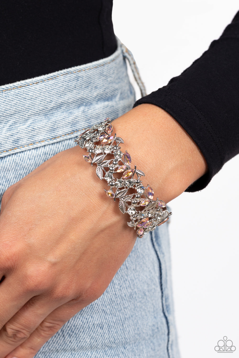 Paparazzi Accessories Feathered Finesse - Orange Round white gems and marquise-cut iridescent orange gems intertwine around polished silver studs and ornate feather-like details in a glitzy pattern. The textured, glittery display is threaded along elastic