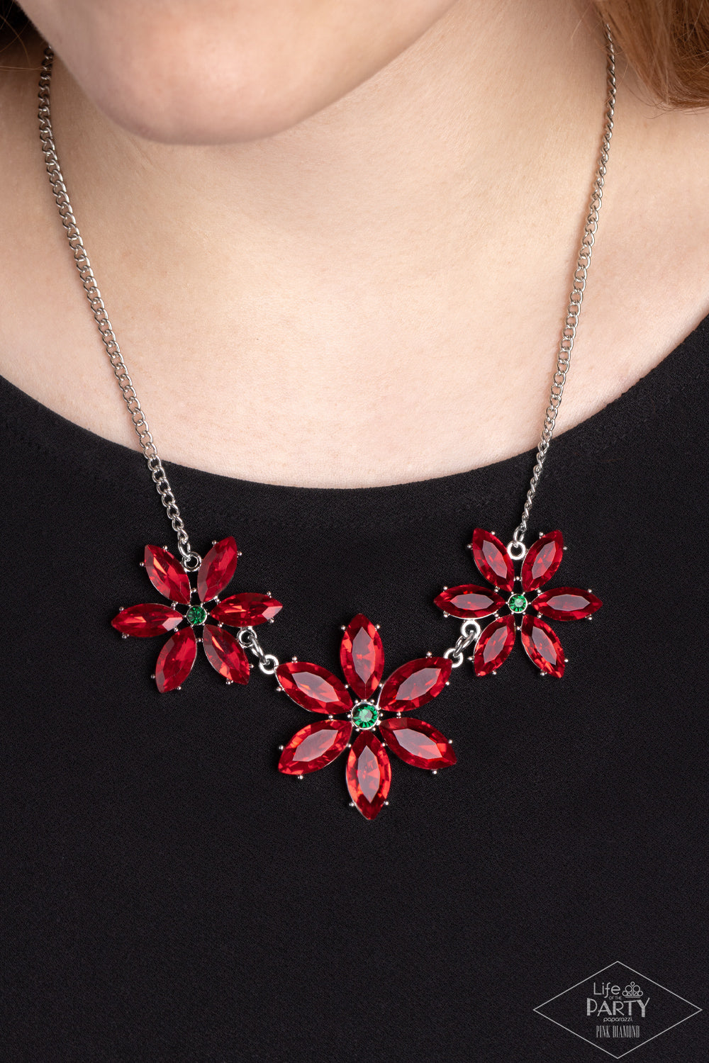Paparazzi Accessories Meadow Muse - Multi Rich red marquise cut rhinestones gather into whimsical flowers dotted with brilliant emerald rhinestone centers. The sparkling red gems are set in pronged settings and connect to a dainty silver chain creating a