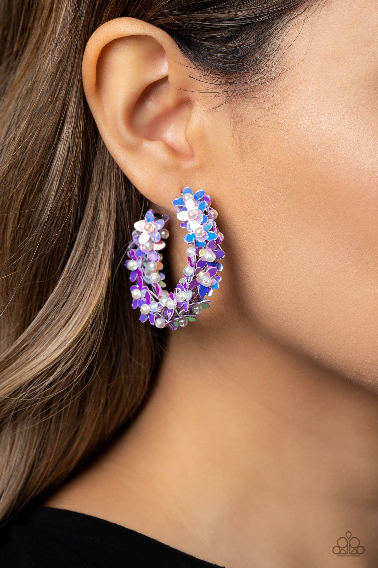Paparazzi Accessories Fairy Fantasia - Purple A floral explosion, encompassing the entirety of a thick silver hoop, features reflective lavender flowers dotted with dainty pearl centers for a dreamy, whimsicality below the ear. Earring attaches to a stand