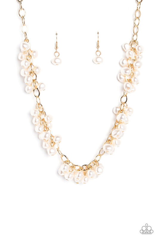 Paparazzi Accessories Pearl Parlor - Gold A cascade of classic white pearly beads dangle from a high-sheen gold, oval linked chain. The pearly beads cluster across the neckline, creating a refined pop of color. Features an adjustable clasp closure. Sold a