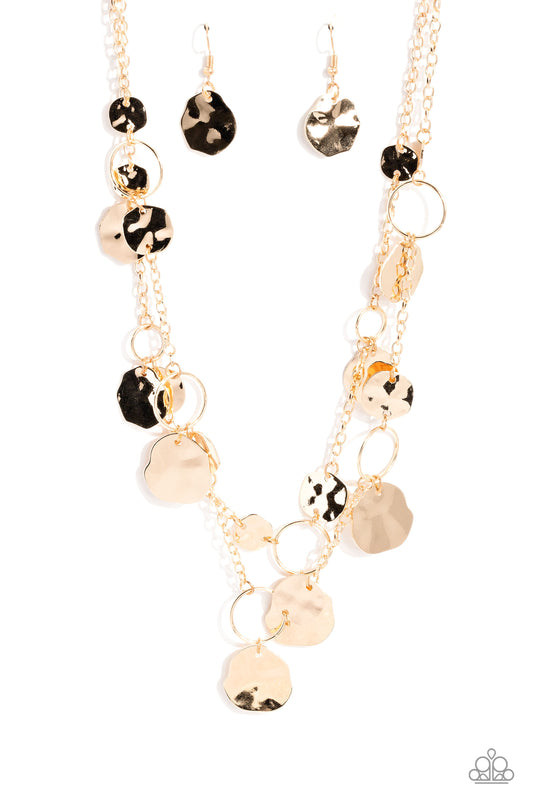 Paparazzi Accessories Hammered Horizons - Gold Infused along a double-stranded gold chain, smooth gold hoops and abstract, hammered gold discs fall down the neckline for an edgy, boisterous display. Features an adjustable clasp closure. Sold as one indivi