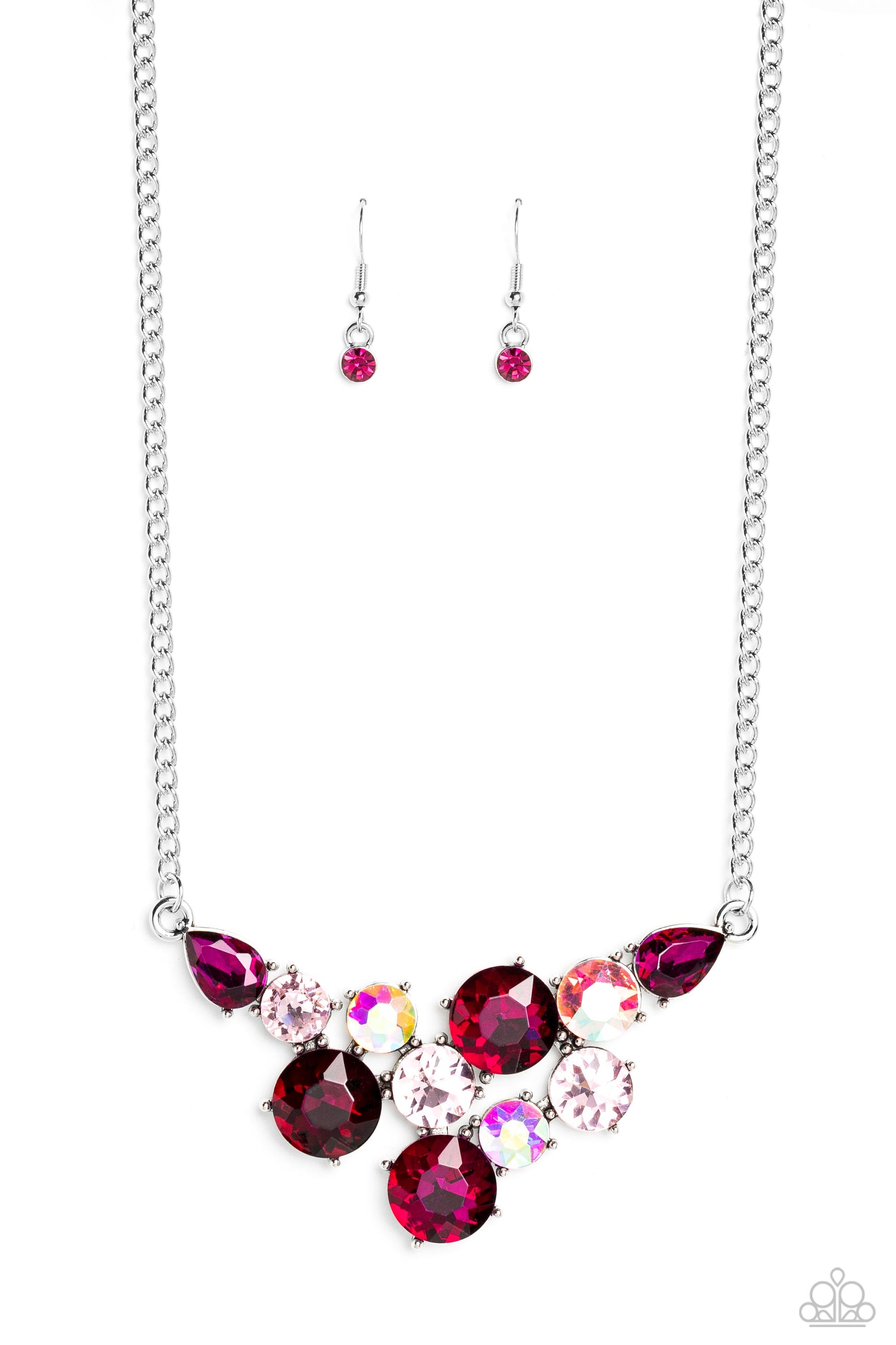 Paparazzi Accessories Round Royalty - Pink An explosion of round gems in varying sizes bordered by teardrop gems cluster together to create a glittery pink fringe down the neckline. Featured in fuchsia, light pink, and iridescent hues, each gem reflects l