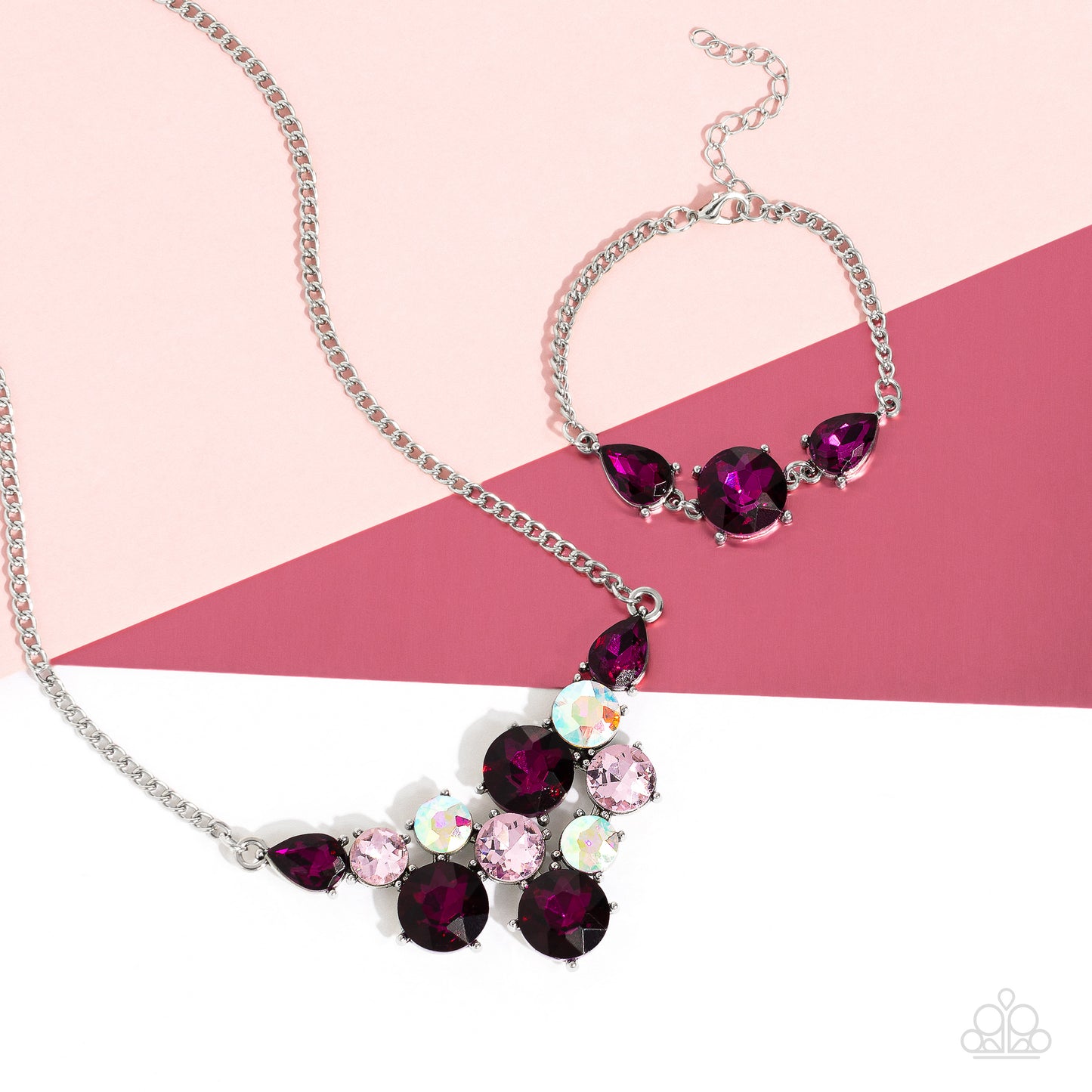 Paparazzi Accessories Round Royalty - Pink An explosion of round gems in varying sizes bordered by teardrop gems cluster together to create a glittery pink fringe down the neckline. Featured in fuchsia, light pink, and iridescent hues, each gem reflects l
