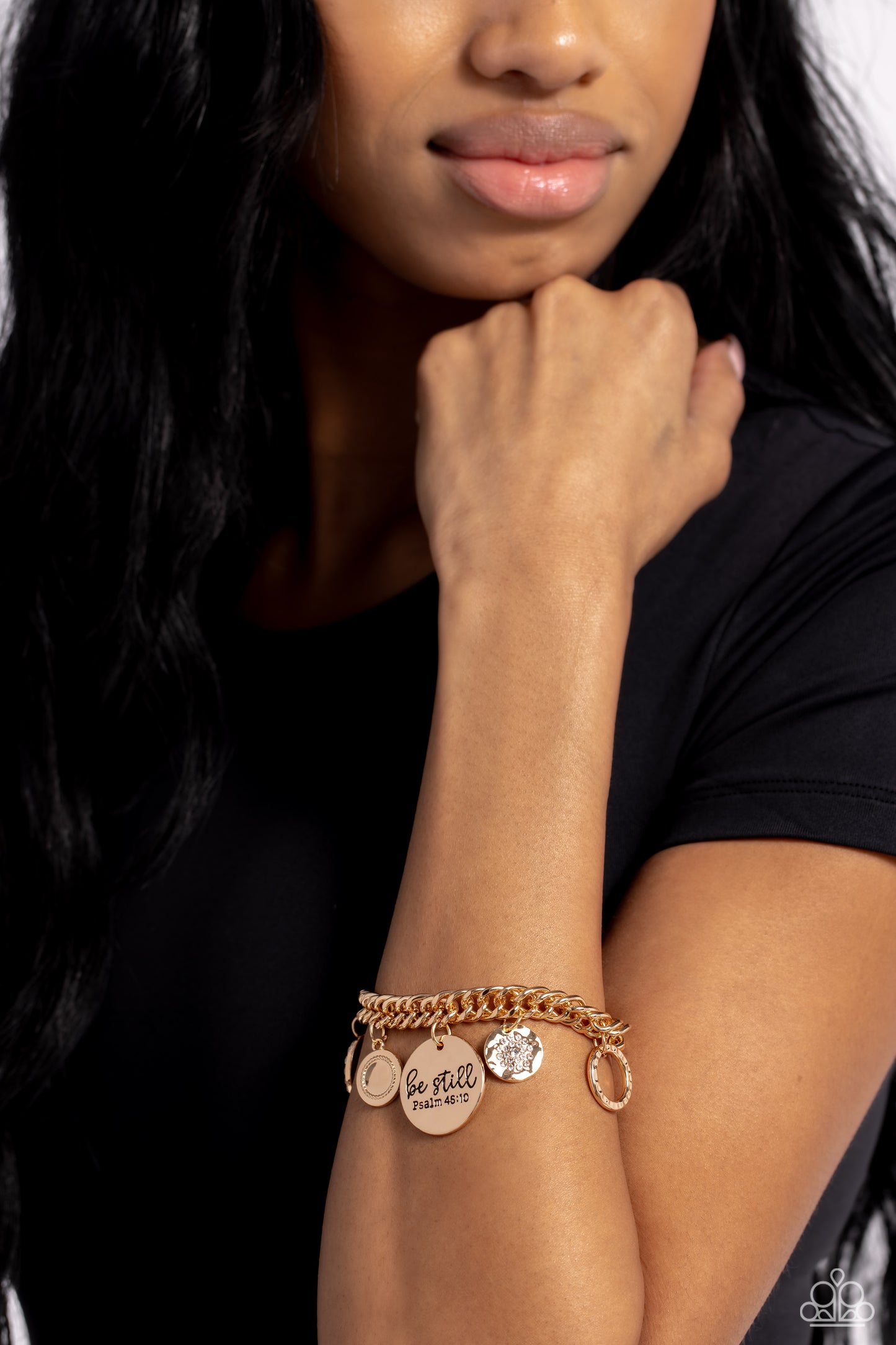 Paparazzi Accessories GLITTER and Grace - Gold Gliding from a thick gold curb chain, a collection of refined charms adds some texture and shimmer to this monochromatic mash-up. An oversized, hammered disc is stamped with the phrase "be still" with the scr