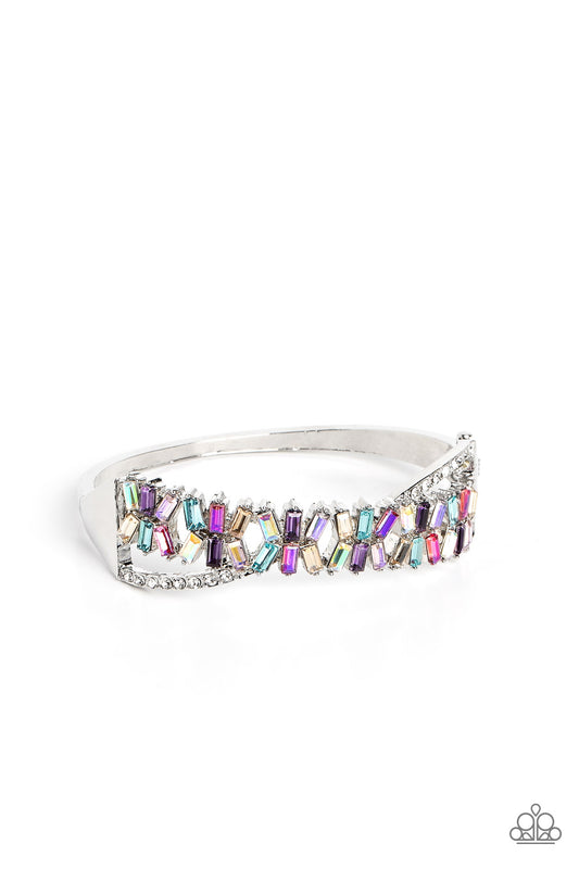 Paparazzi Accessories Timeless Trifecta - Multi Modeled after the infinity symbol curves, a row of dainty white rhinestones playfully interacts with emerald-cut gems splashed in shades of amethyst, light blue, pink, smoked topaz, and iridescence. Set in c