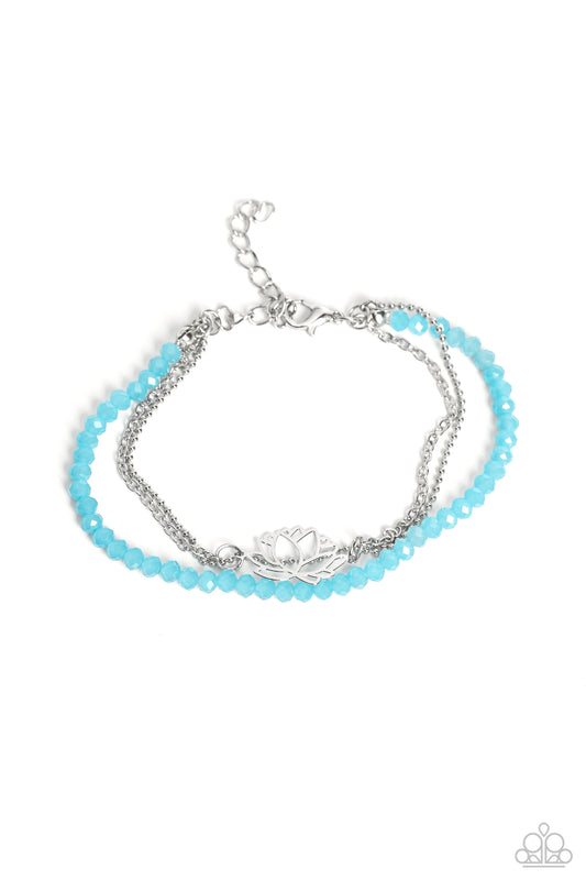 Paparazzi Accessories A LOTUS Like This - Blue Faceted blue beads combine with a dainty silver chain, and a dainty silver ball chain for a colorful display around the wrist. Falling from the classic chain, an airy silver lotus blooms, adding a whimsical f