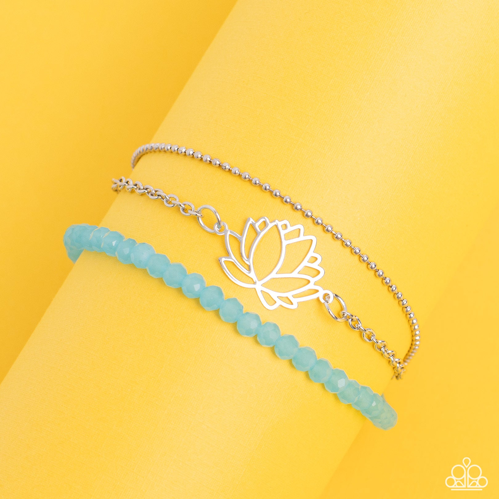 Paparazzi Accessories A LOTUS Like This - Blue Faceted blue beads combine with a dainty silver chain, and a dainty silver ball chain for a colorful display around the wrist. Falling from the classic chain, an airy silver lotus blooms, adding a whimsical f