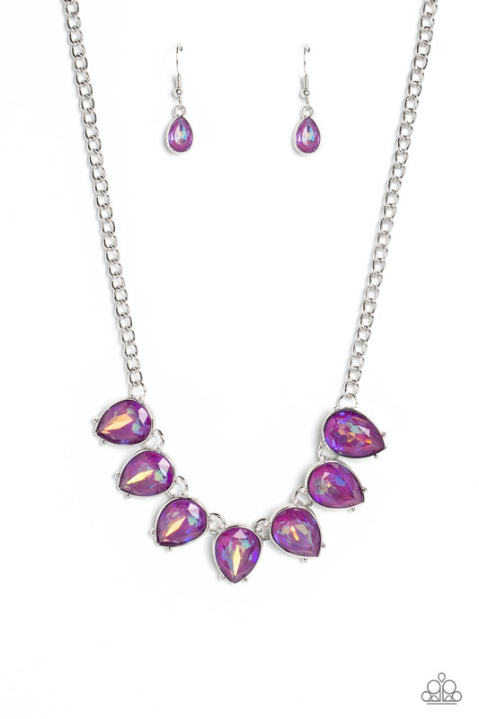 Paparazzi Accessories FLIRTY Dancing - Purple Gliding down a classic silver chain, a twinkling collection of silver-pronged, amethyst, reflective, upside down teardrops glitter down the chest. The sparkly and sharp display fearlessly dances to its own bea