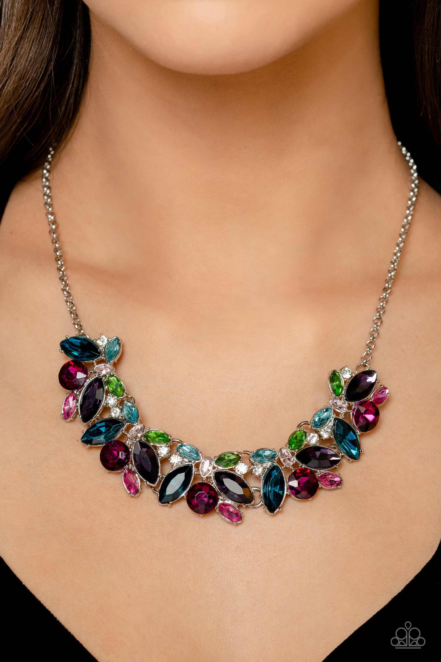 Paparazzi Accessories Crowning Collection - Multi Featuring pronged silver fittings, a sparkly series of marquise-cut rhinestones in varying sizes and opacities are splashed in hues of purple, blue, light blue, baby pink, pink, and green as they fan out b