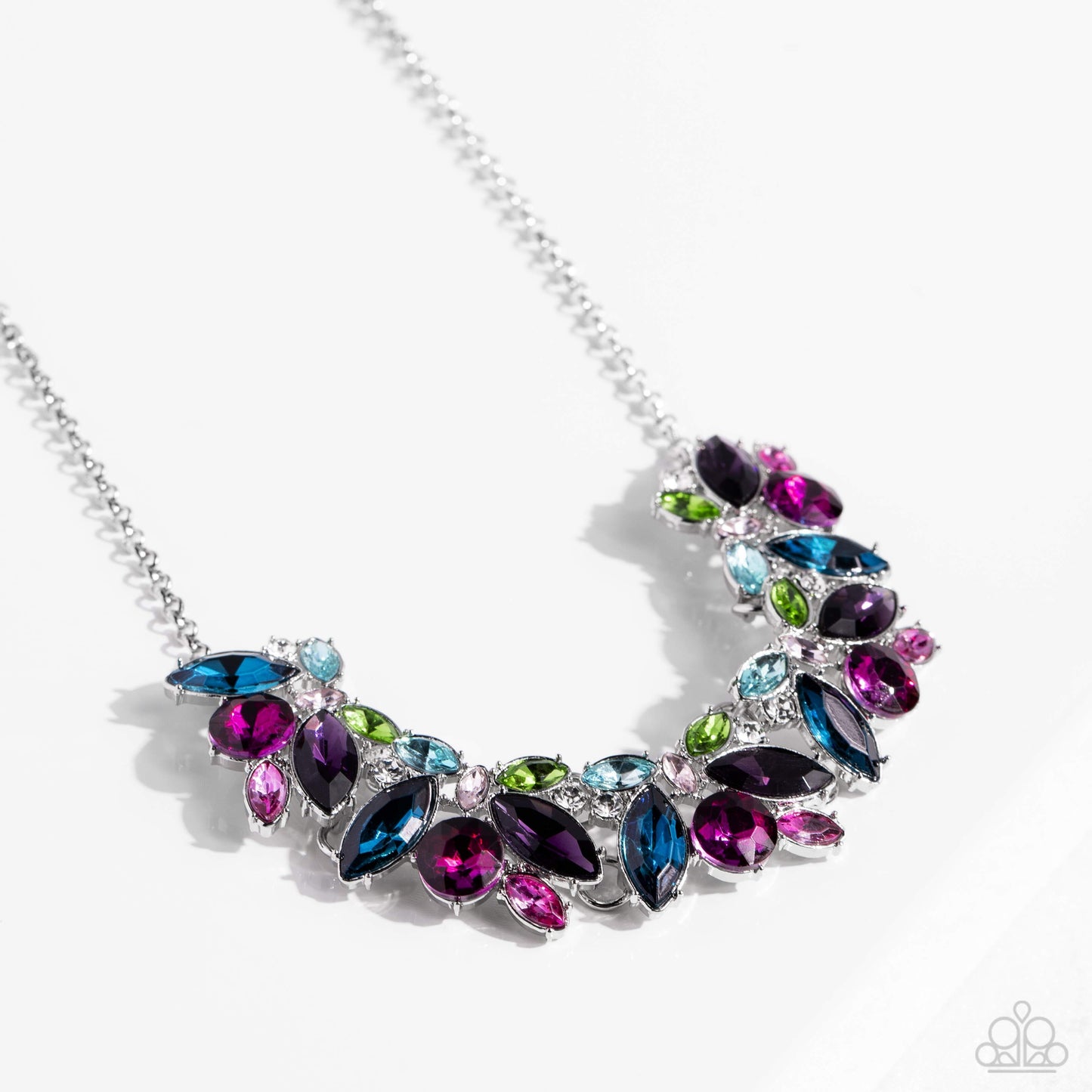Paparazzi Accessories Crowning Collection - Multi Featuring pronged silver fittings, a sparkly series of marquise-cut rhinestones in varying sizes and opacities are splashed in hues of purple, blue, light blue, baby pink, pink, and green as they fan out b