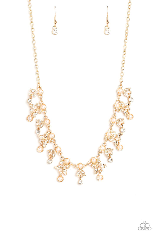 Paparazzi Accessories Garden Princess - Gold Infused along a classic gold chain, a row of pearls, pressed into gold frames, stands out against the collar for a touch of refinement. Dangling below the row of pearls, a shimmery collection of leaf-like filig