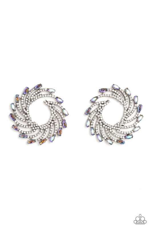 Paparazzi Accessories Firework Fanfare - Multi Shimmery strands of silver spin out from an airy center, creating an exaggerated firework-like display at the ear. An explosion of dainty white rhinestones lines the swirls and curves of the shimmery display