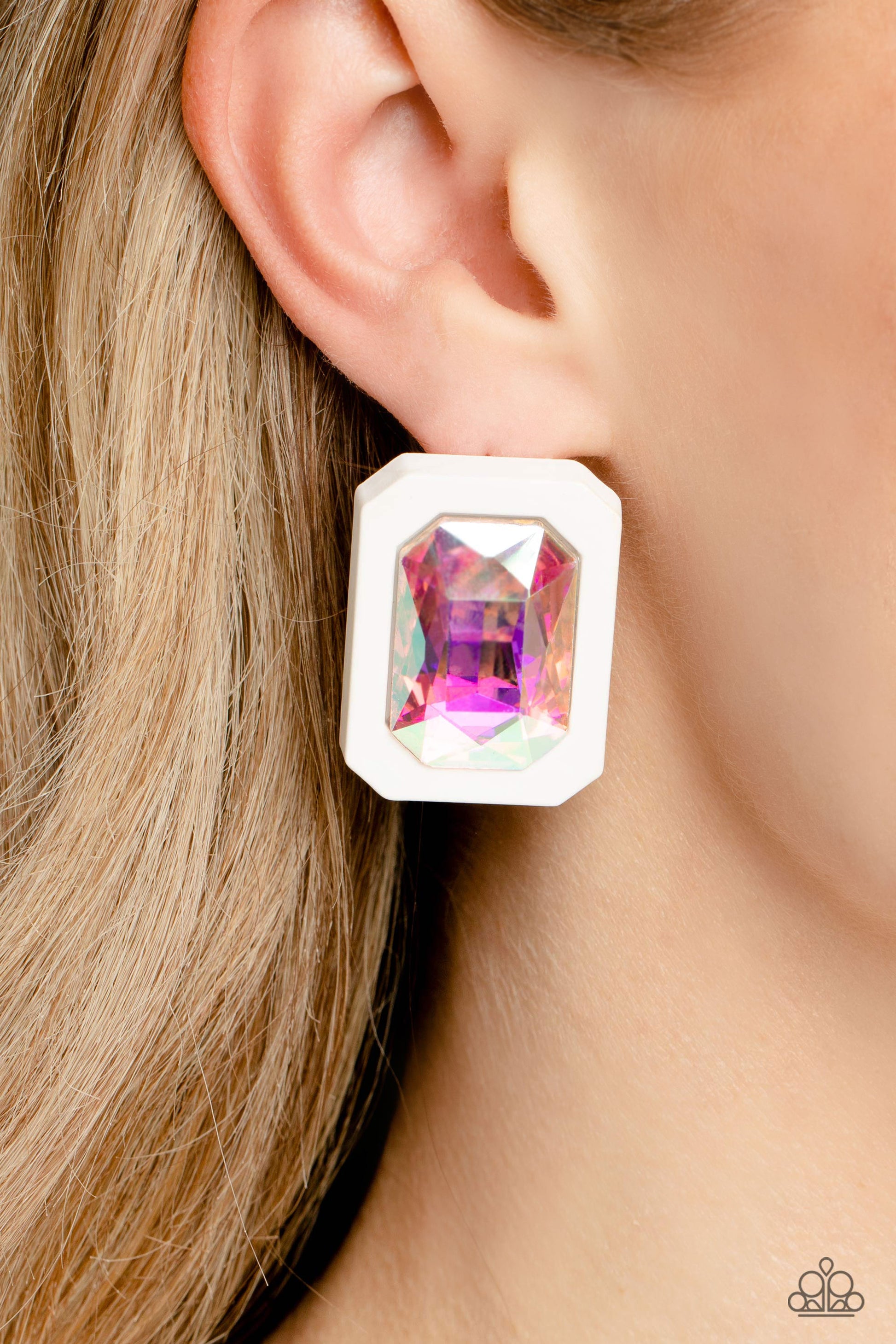 Paparazzi Accessories Edgy Emeralds - Multi 2 Standing out against a white rubber backdrop, an oversized, faceted emerald-cut iridescent gem shimmers and shines for an edgy sparkle against the ear. Earring attaches to a standard post fitting. Due to its p