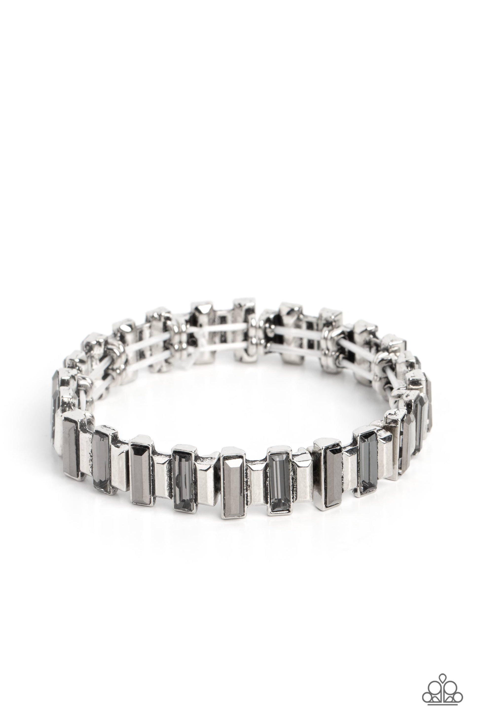Paparazzi Accessories BURSTING the Midnight Oil - Silver Set in clusters around the wrist on elastic stretchy bands, a collection of shiny silver bars with a metallic finish and smoky bars with a reflective finish glimmer for an industrial, glitzy, statem