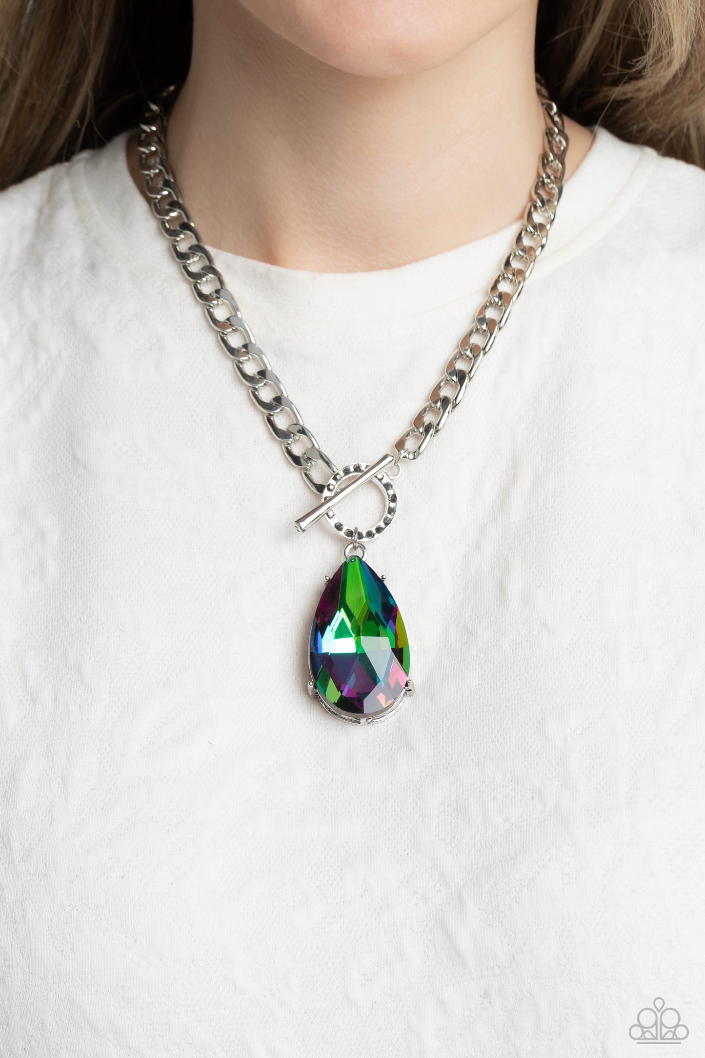 Paparazzi Accessories Edgy Exaggeration - Multi Featuring an elegant lariat closure, an oversized, faceted, stellar UV shimmery teardrop gem, encased in an elevated pronged silver frame cascades from the bottom of a silver curb chain in a whimsical fashio
