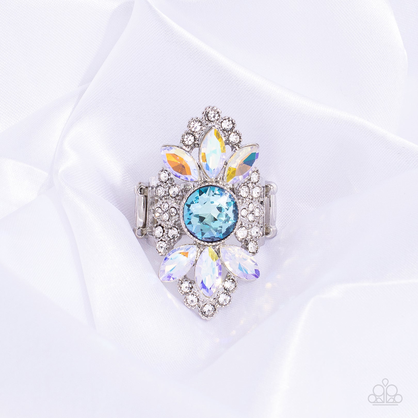 Paparazzi Accessories GLISTEN Here! - Blue Dotted with an effulgent display of sparkles, glistening dainty white rhinestones embedded in shiny silver filigree climb the finger, coalescing into a dramatic frame. Featured in the center of the glitzy display