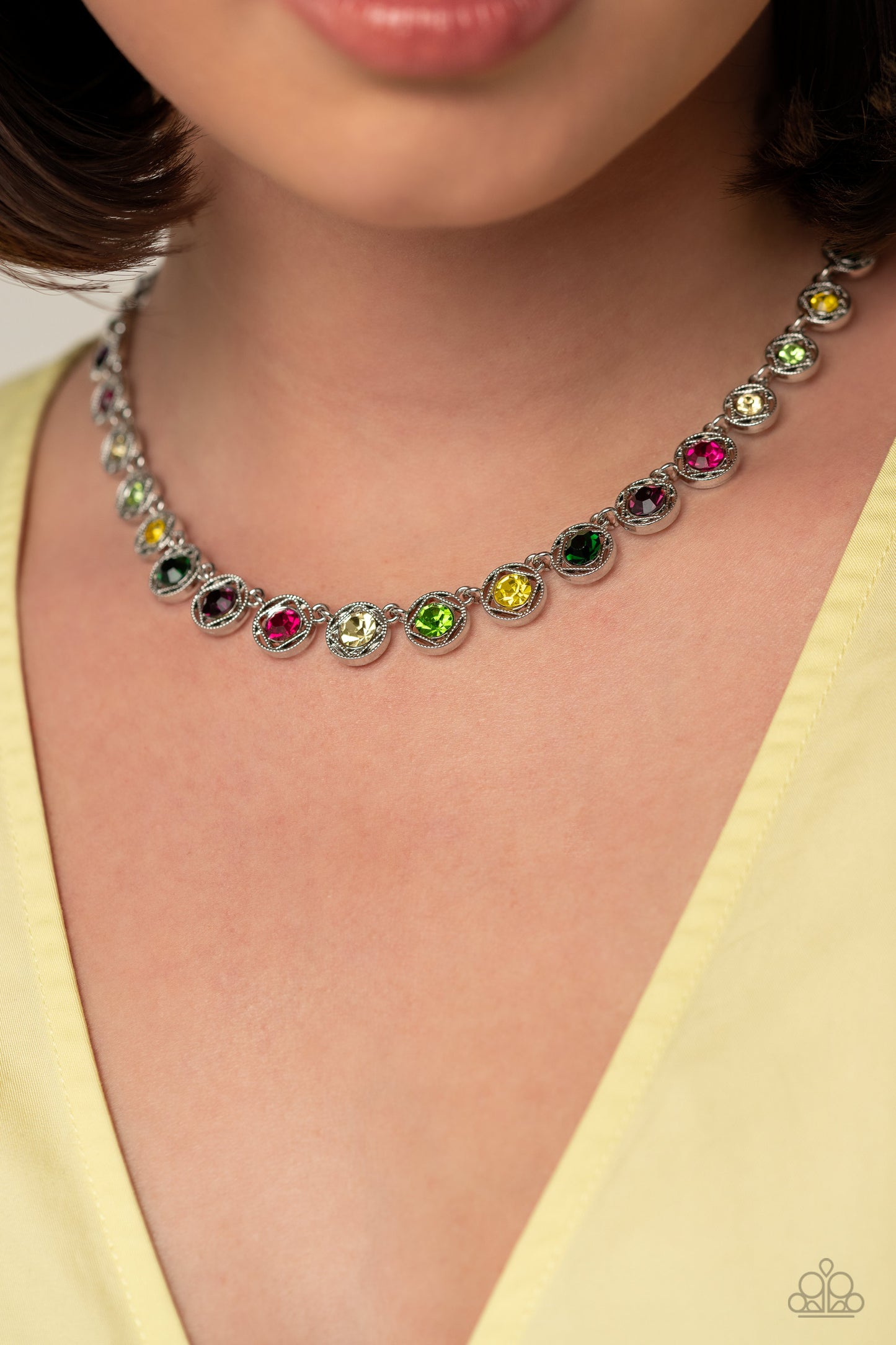Paparazzi Accessories Kaleidoscope Charm - Multi Spanning around the entirety of the neckline, a refined collection of colorful rhinestones are pressed into airy, studded, silver square frames, tilted on their sides for a three-dimensional shimmer. The fr