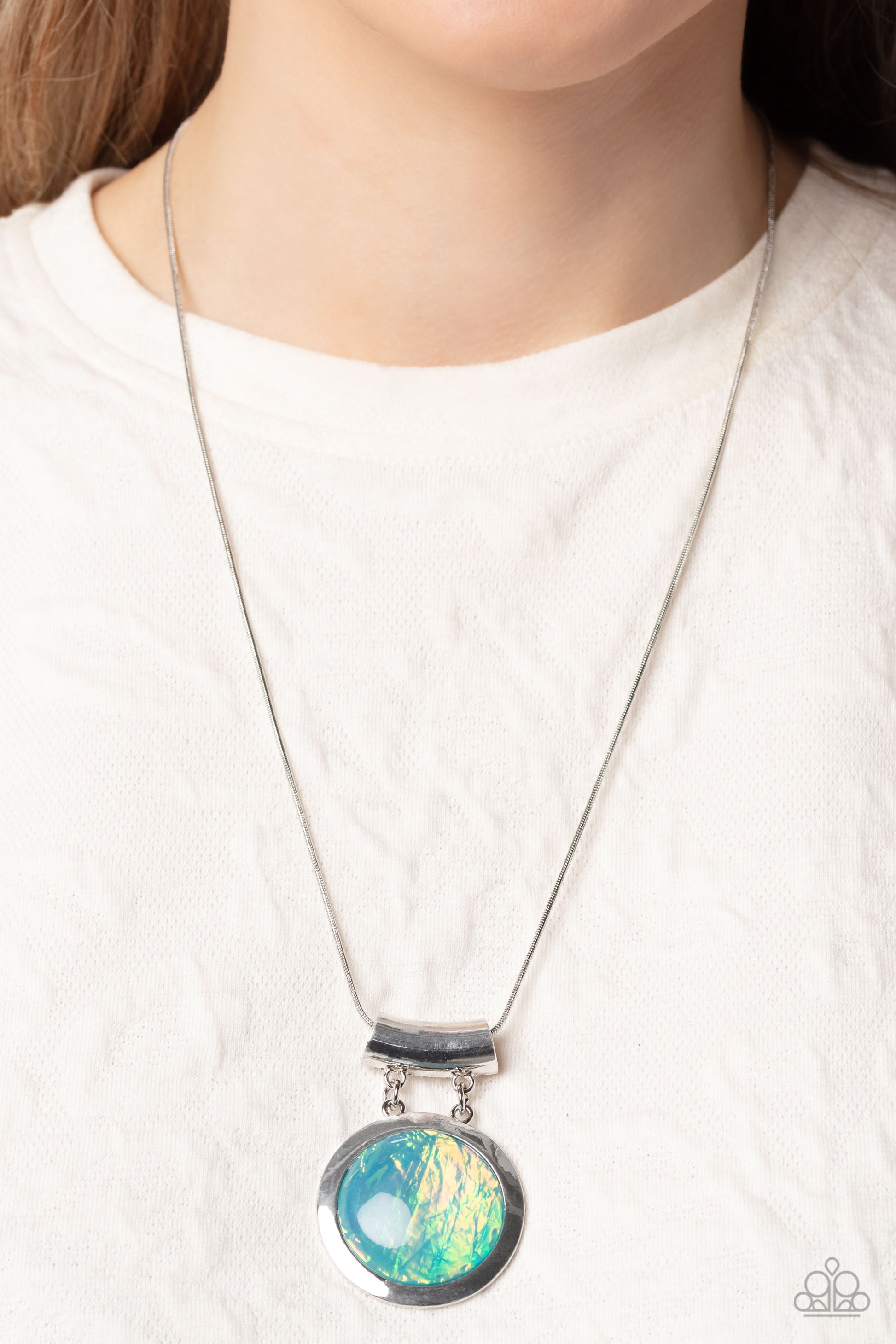 Paparazzi Accessories Starlight Starbright - Blue Featuring a refracted shimmer and an opalescent finish, an oversized, glassy blue gem falls along the chest on a silver snake chain to create a hypnotic pop of color. The exaggerated sparkle is pressed int