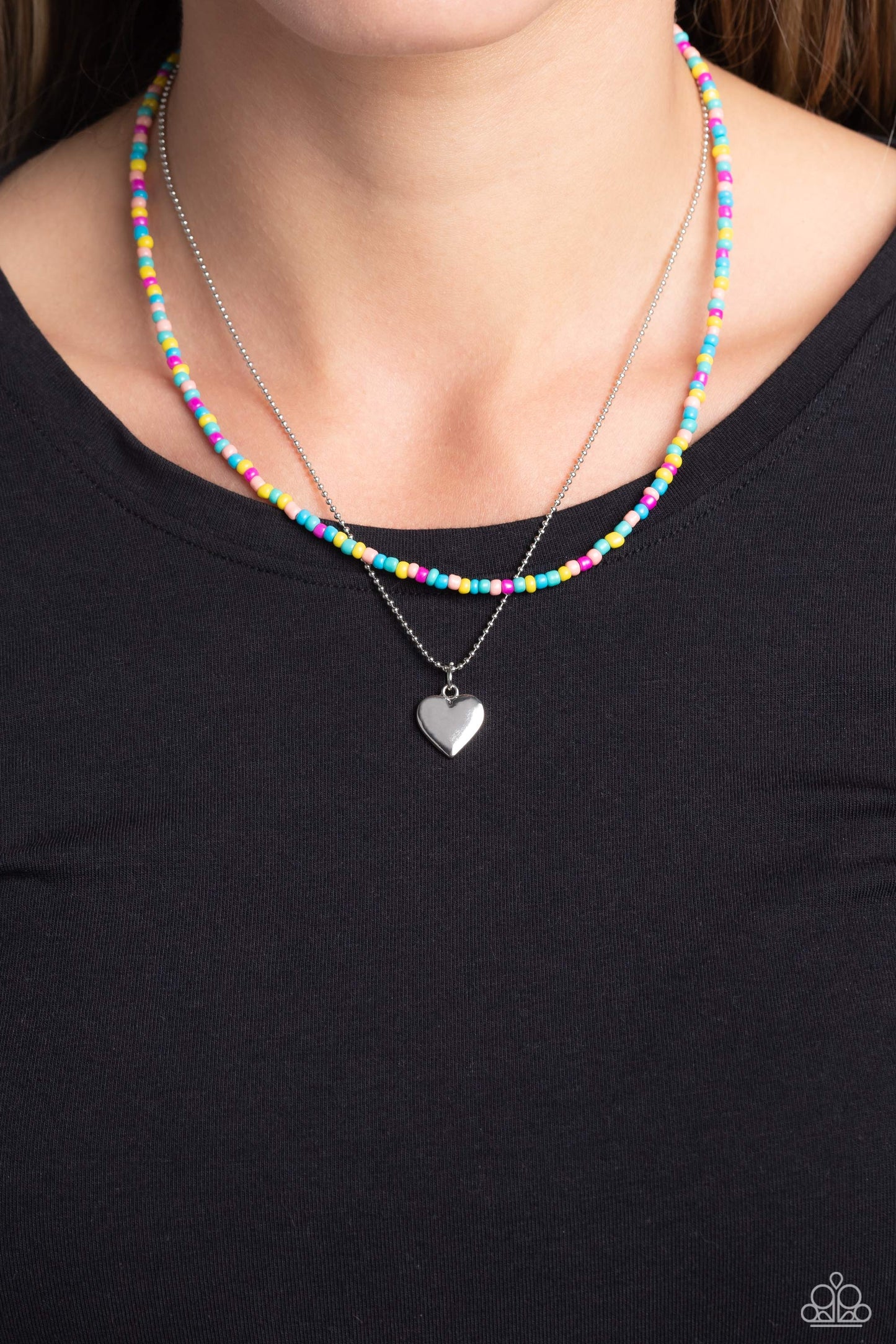 Paparazzi Accessories Candy Store - Multi Multicolored seed beads are threaded along a wire, falling along the collar in a capricious pattern. A delicate silver ball chain featuring a dangling silver heart pendant, layers together with the colorful beads