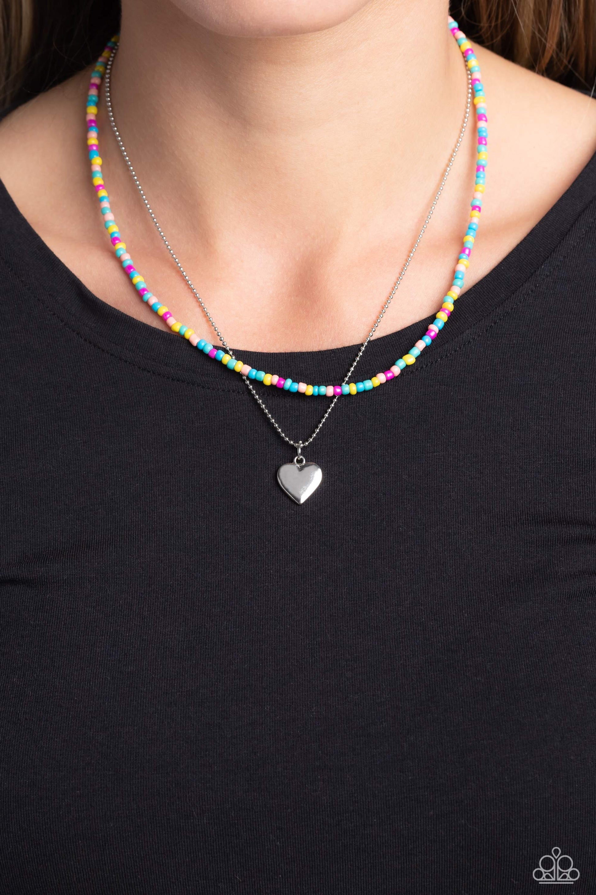 Paparazzi Accessories Candy Store - Multi Multicolored seed beads are threaded along a wire, falling along the collar in a capricious pattern. A delicate silver ball chain featuring a dangling silver heart pendant, layers together with the colorful beads