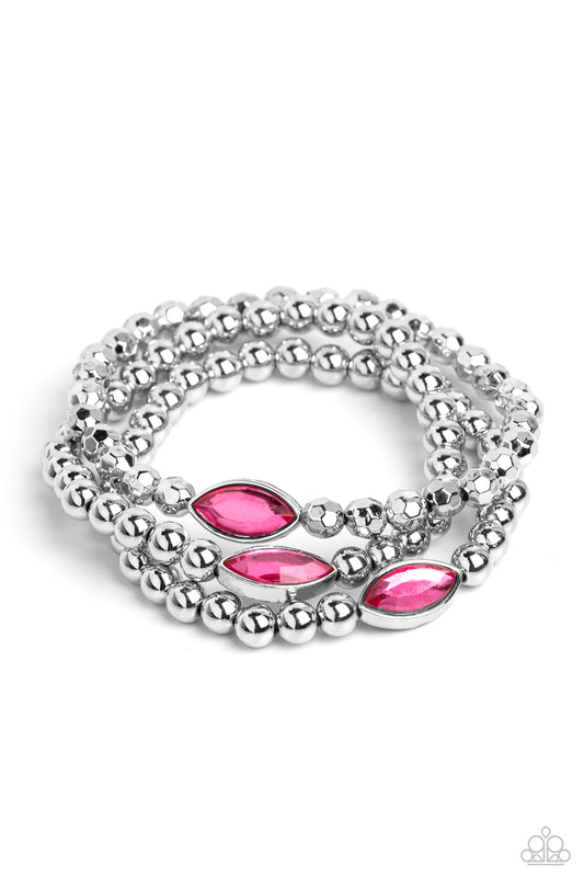 Paparazzi Accessories Twinkling Team - Pink Featured in the center of a faceted and smooth silver beaded display, a dazzling Pink Peacock, marquise-cut gem pressed in a sleek silver frame wraps around the wrist on elastic stretchy bands for a classy state