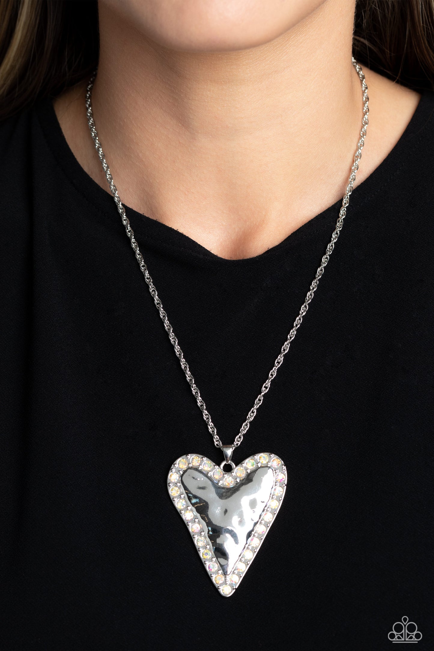 Paparazzi Accessories Radiant Romeo - Multi Hammered in antiqued texture, an oversized, abstract silver heart swings from the bottom of a silver chain for a whimsical look. Silver studs and glittery iridescent gems border the hammered texture for a touch