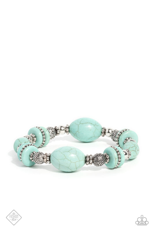 Paparazzi Accessories Changing Cleopatra - Blue Infused along an elastic stretchy band, an Egyptian-esque collection of muted turquoise stones in various sizes, striped silver beads, textured silver beads, floral silver wheel beads, and silver accents wra