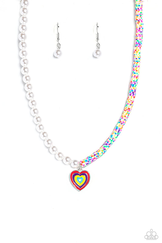 Paparazzi Accessories Precise Psychedelic - Multi A strand of gleaming white pearls and white clay discs striped with green, blue, purple, pink, red, orange, and yellow combine to create a half-and-half fashionable mashup down the neckline. A heart pendan
