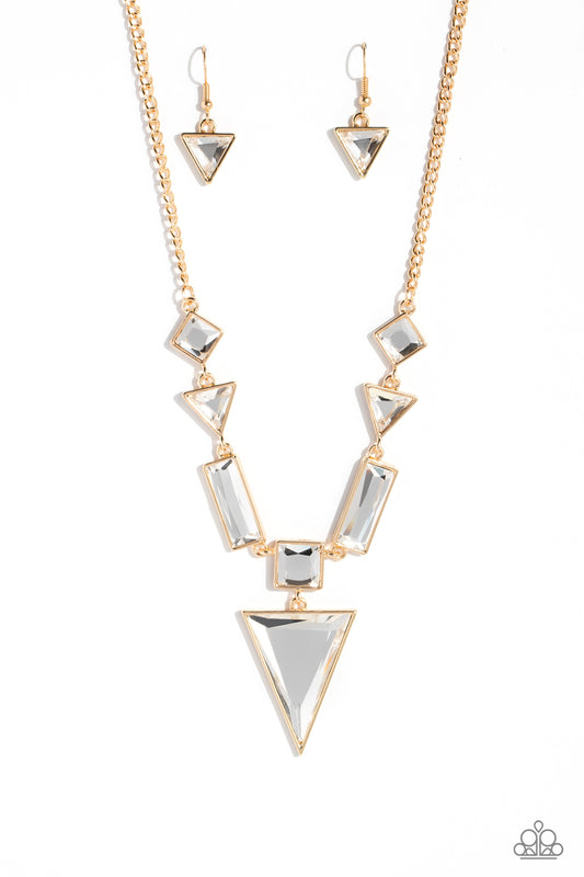 Paparazzi Accessories Fetchingly Fierce - Gold An array of glassy white gems are chiseled into geometric shapes and pressed into shimmery gold frames. The angular display falls to a dramatic point at the center, where a square-cut gem anchors an upside-do