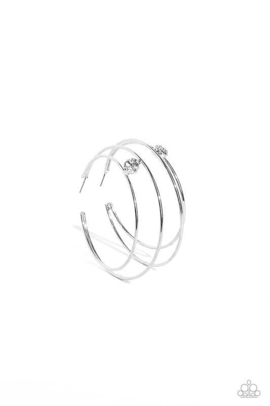 Paparazzi Accessories Theater HOOP - White Lodged between two dainty silver crescent frames that curve into double hoops, a faceted white rhinestone rests for a delicate shimmer near the ear. Earring attaches to a standard post fitting. Hoop measures appr