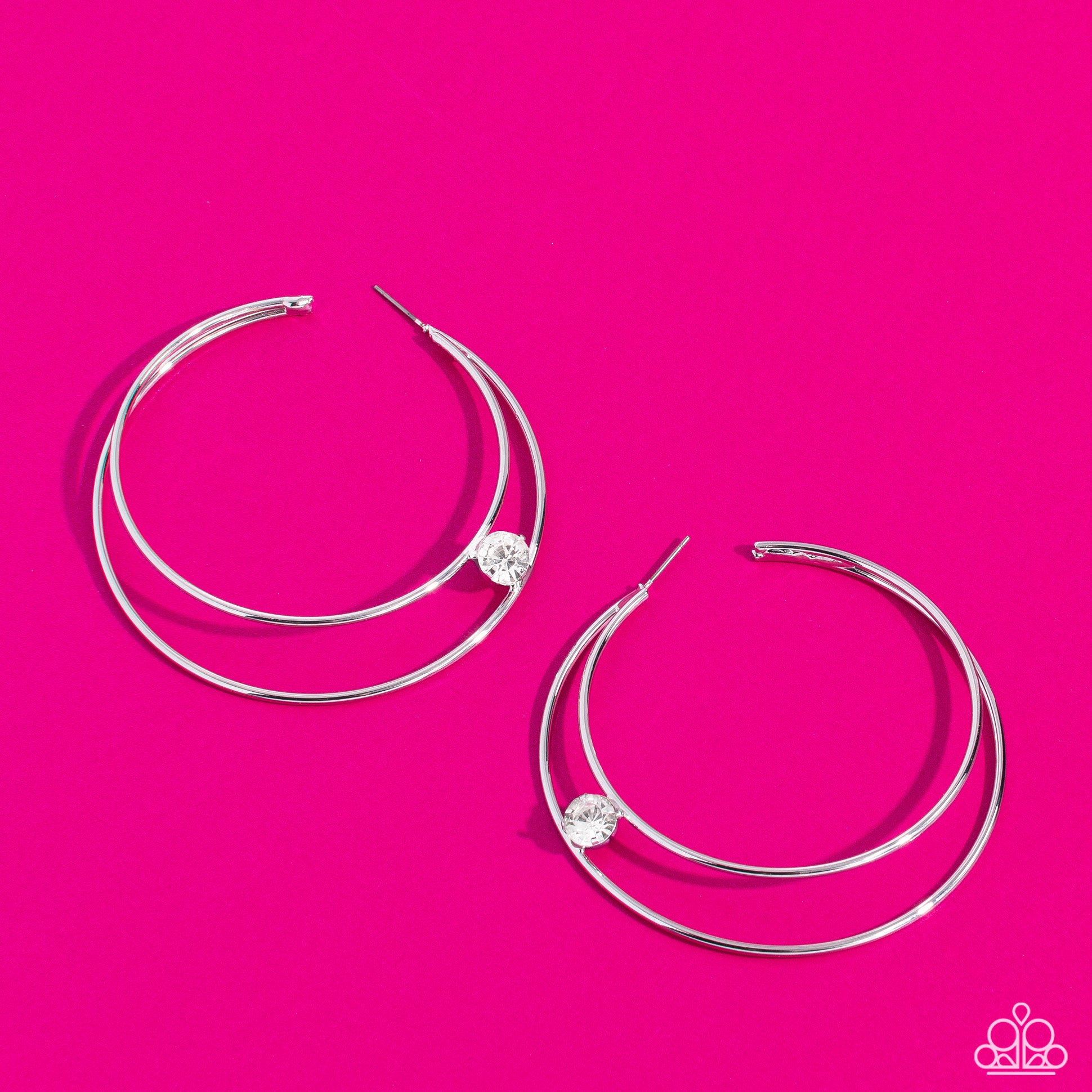 Paparazzi Accessories Theater HOOP - White Lodged between two dainty silver crescent frames that curve into double hoops, a faceted white rhinestone rests for a delicate shimmer near the ear. Earring attaches to a standard post fitting. Hoop measures appr