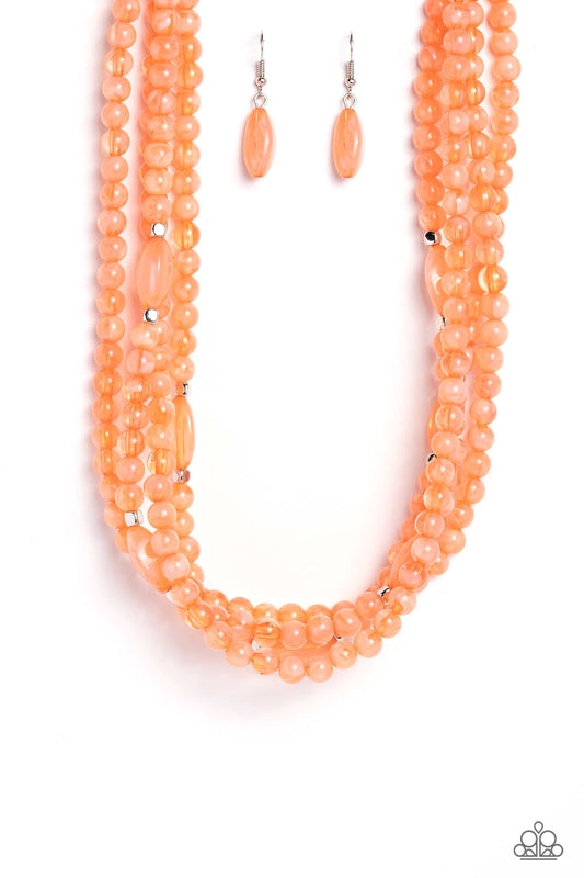 Paparazzi Accessories Layered Lass - Orange Varying in shape and color, a collection of milky round and oval Peach Pink beads are threaded along invisible wires below the collar. Shiny silver cube beads are sprinkled throughout the strands, adding hints o