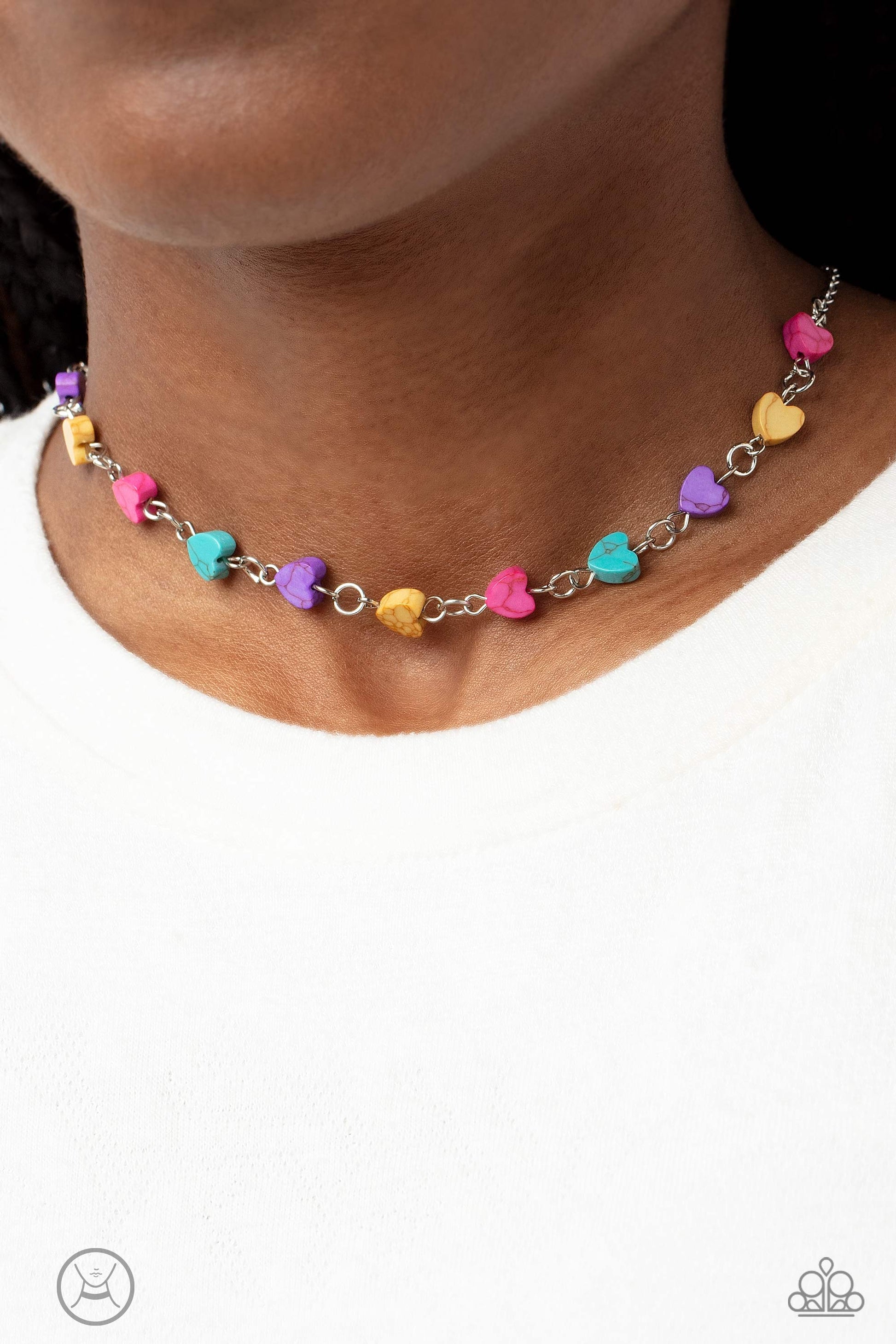 Paparazzi Accessories Wild at Heart - Pink Heart-shaped stones in shades of hot pink, yellow, purple and turquoise dances along a dainty, shimmery silver chain below the collar for a romantic finish. Features an adjustable clasp closure. As the stone elem
