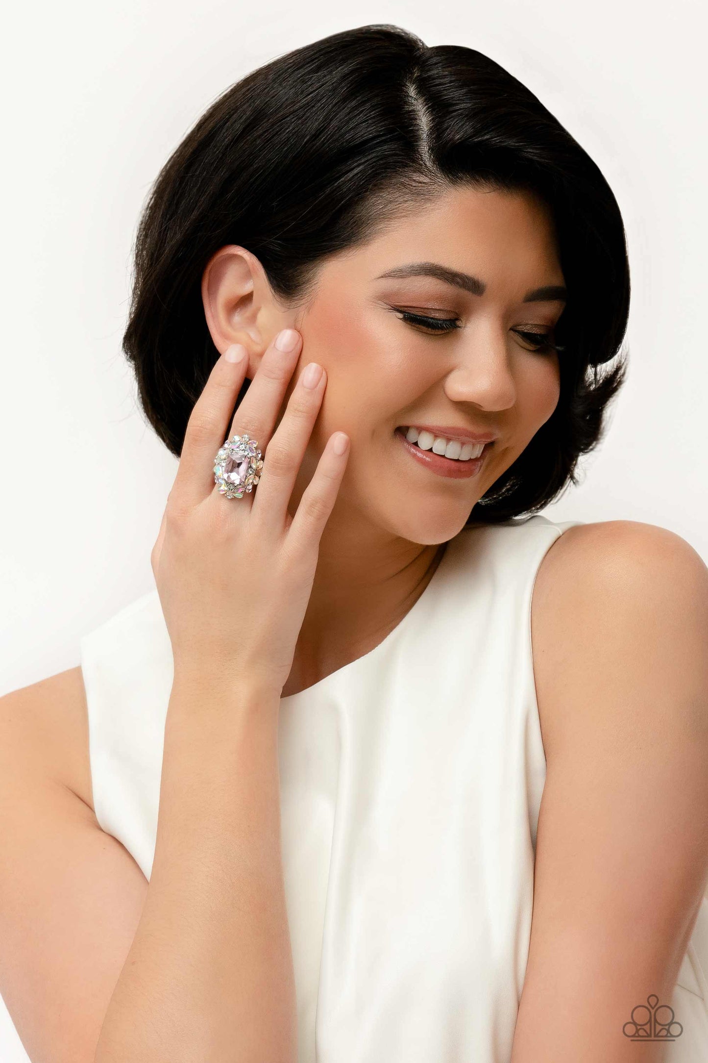 Paparazzi Accessories Dynamic Diadem - Pink A faceted radiant-cut pink gem is pressed into an elaborate frame filled with blinding round, teardrop and marquise-cut gems in shades of white, pink, and iridescent for a blingy statement atop the finger. Featu