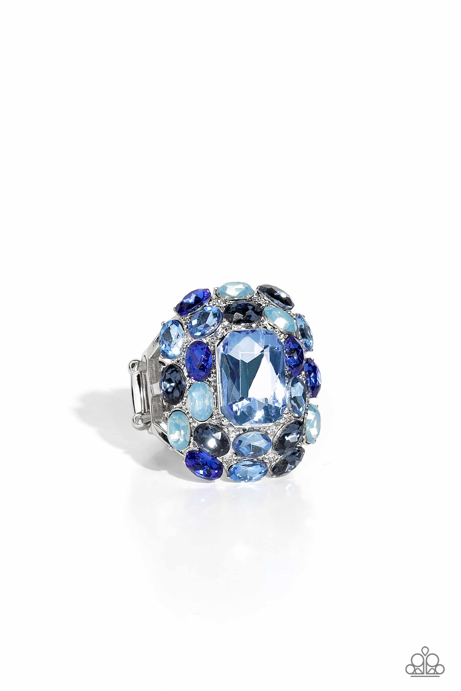 Paparazzi Accessories Perfectly Park Avenue - Blue A faceted radiant-cut light blue gem is pressed into an elaborate silver frame filled with blinding oval-cut gems in varying shades and opacities of blue for a dynamically colorful statement atop the fing