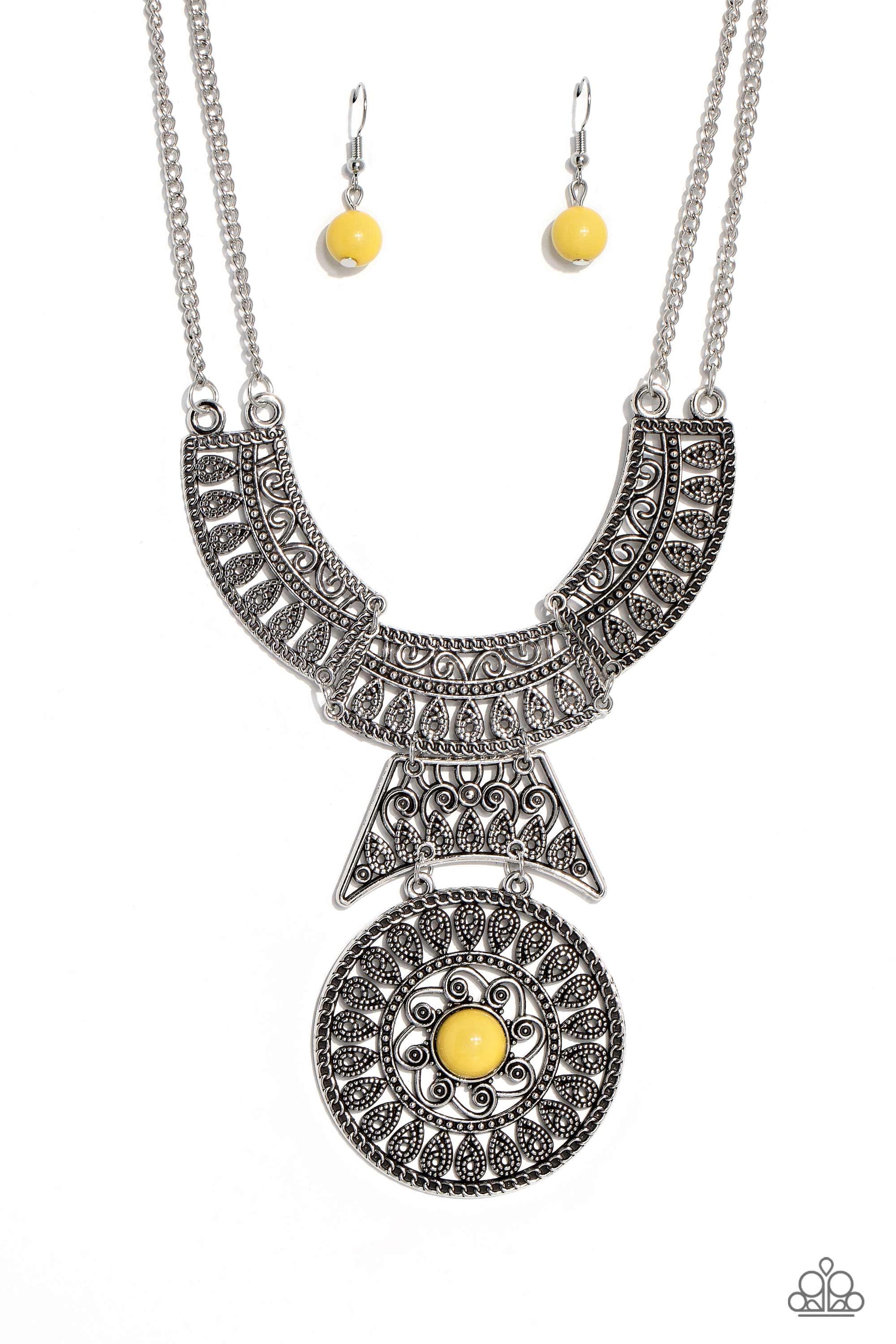 Paparazzi Accessories Fetching Filigree - Yellow Rows of oversized silver filigree frames stack into a crescent-shape that is anchored by additional silver filigree frames that layer down the neckline. Featured in the center of the lowermost circular fram