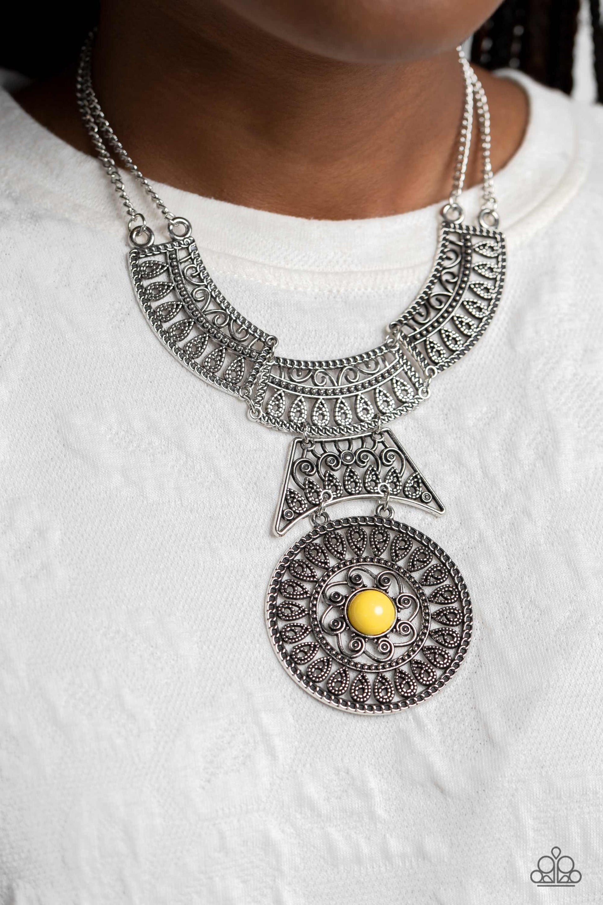 Paparazzi Accessories Fetching Filigree - Yellow Rows of oversized silver filigree frames stack into a crescent-shape that is anchored by additional silver filigree frames that layer down the neckline. Featured in the center of the lowermost circular fram