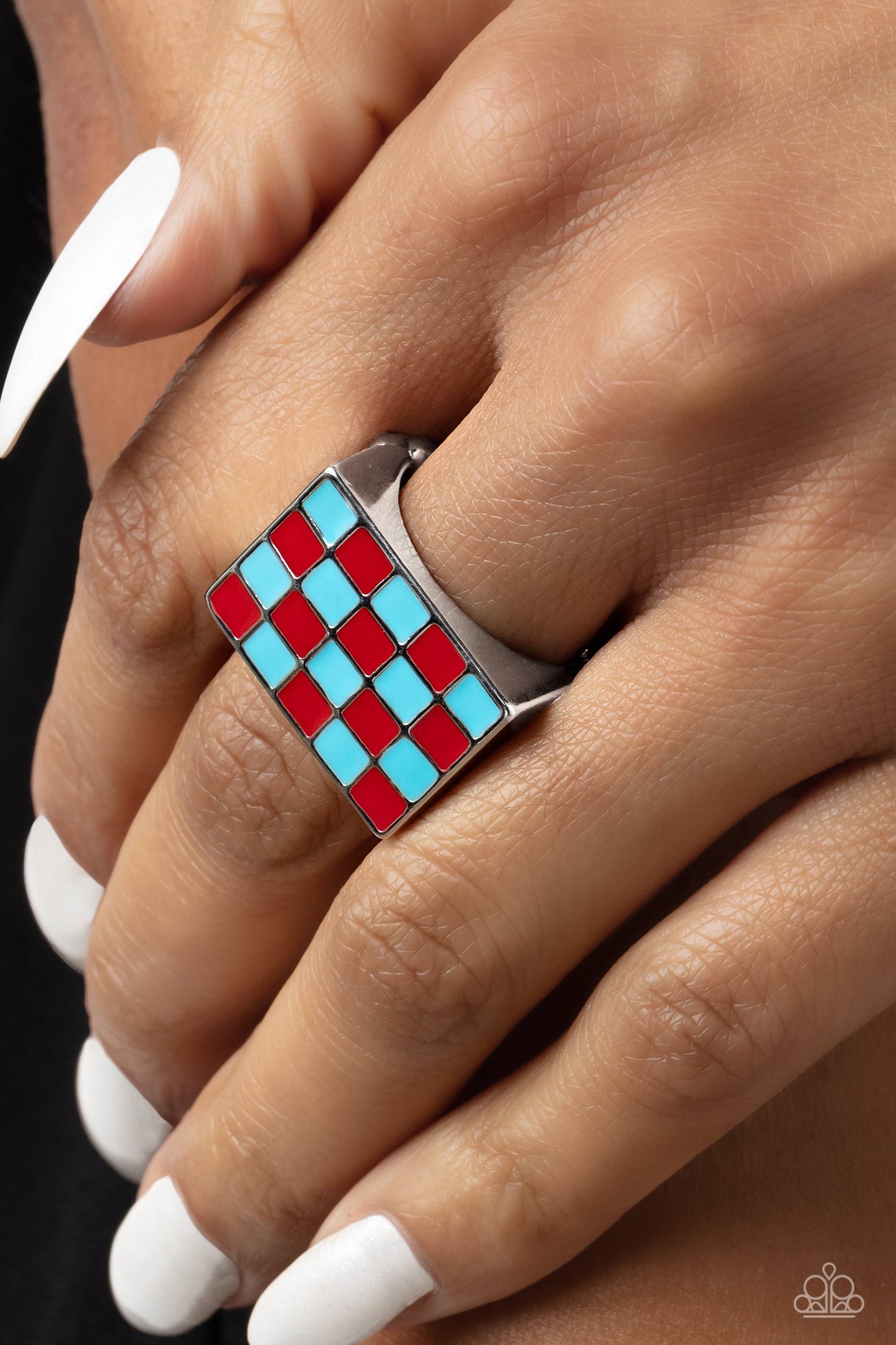 Paparazzi Accessories Checkerboard Craze - Red Featuring a thick silver square surface, linear rows of red squares alternate with light blue squares for a colorful checkerboard statement atop the finger. Features a stretchy band for a flexible fit. Sold a