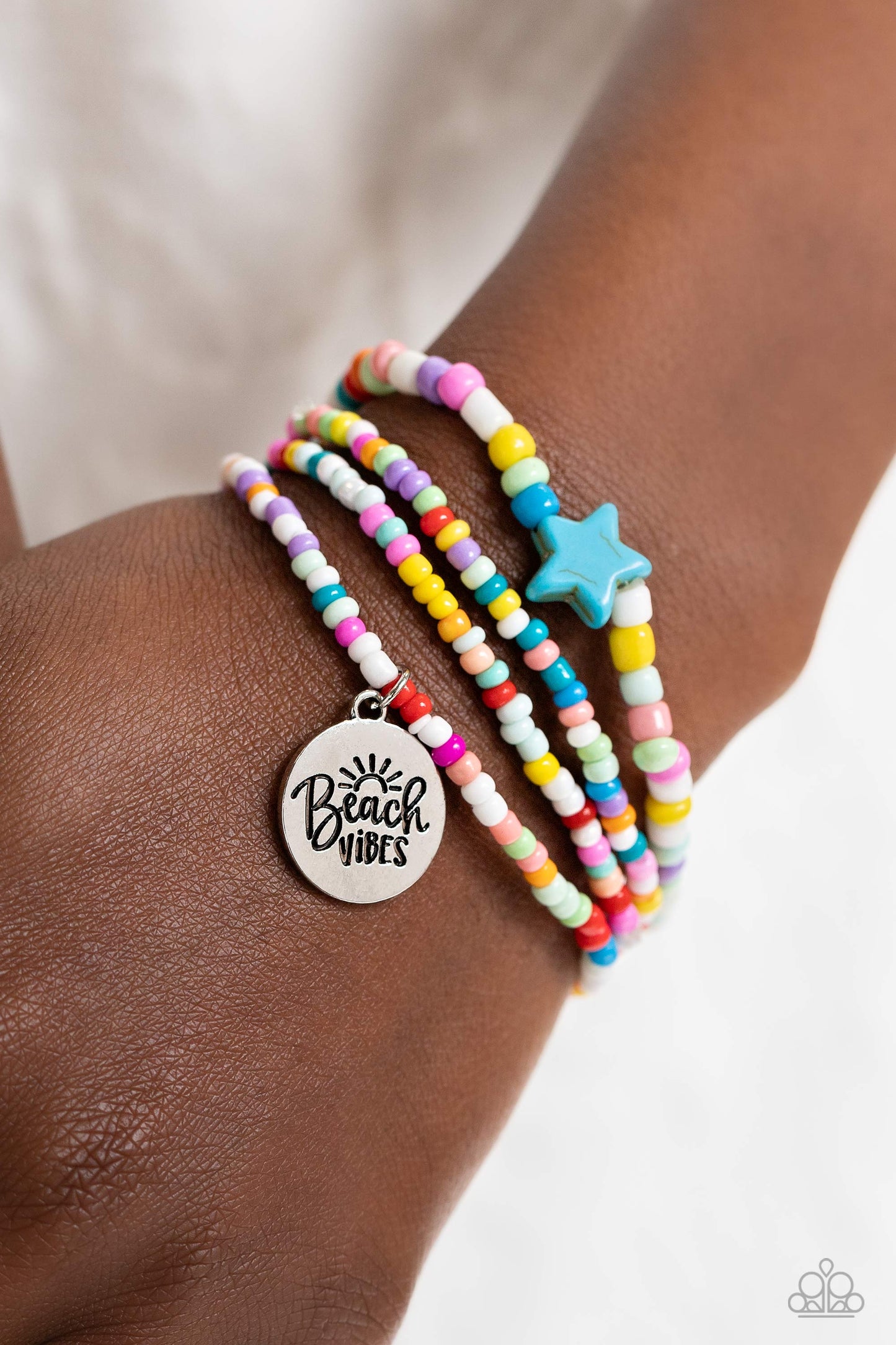 Paparazzi Accessories Wave Riding - Multi Multicolored seed beads wrap around the wrist on elastic stretchy bands for a vivacious pop of color. A turquoise stone star is infused on one of the strands, adding an earthy flourish to the design, while a silve