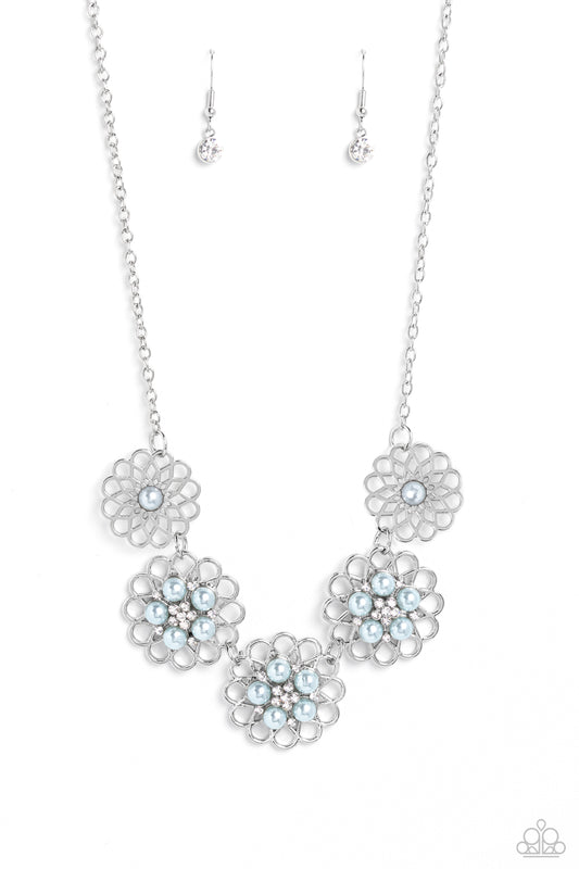 Paparazzi Accessories Mandala Mosaic - Blue Gleaming silver flowers with airy filigree petals are dotted with dainty white rhinestones and Skylight pearl centers for a refined design. The Skylight pearls and dainty white rhinestones form into a smaller fl